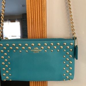 Turquoise coach cross body with gold studs